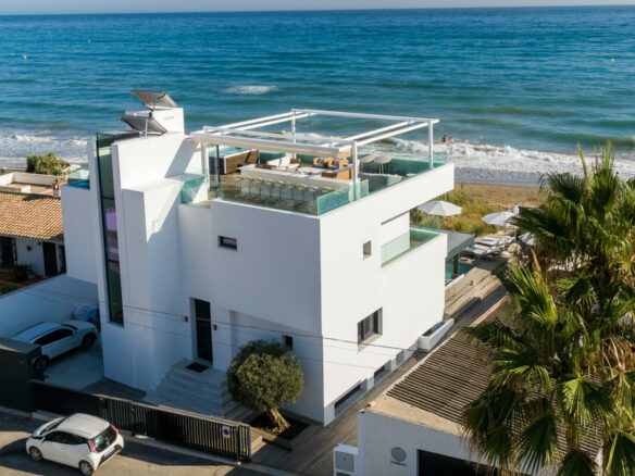 FOR SALE 🏡 Beachfront Villa with Direct Sand Access and Rooftop Wellness Deck – Costabella, Marbella