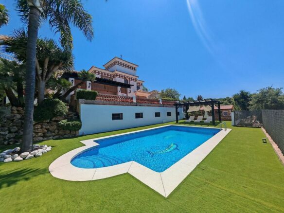 Spacious south-west facing villa with pool steps from the beach in Elviria, Marbella