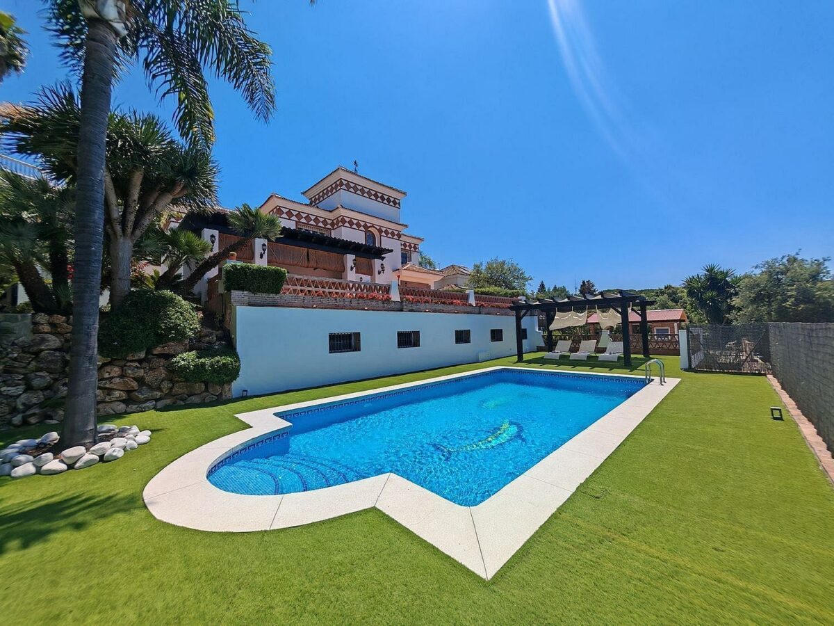 Spacious south-west facing villa with pool steps from the beach in Elviria, Marbella