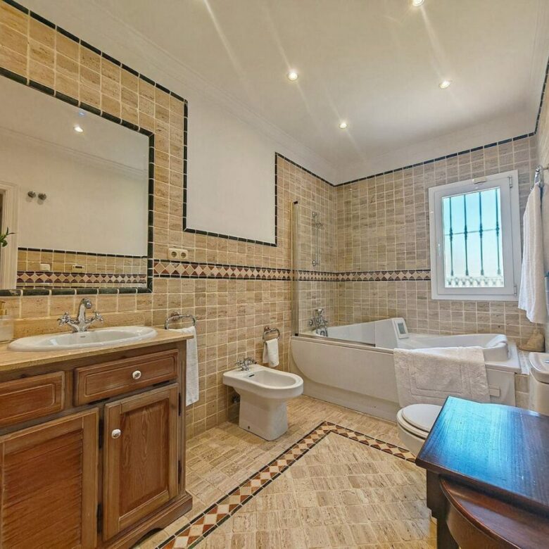 Spacious south-west facing villa with pool steps from the beach in Elviria, Marbella