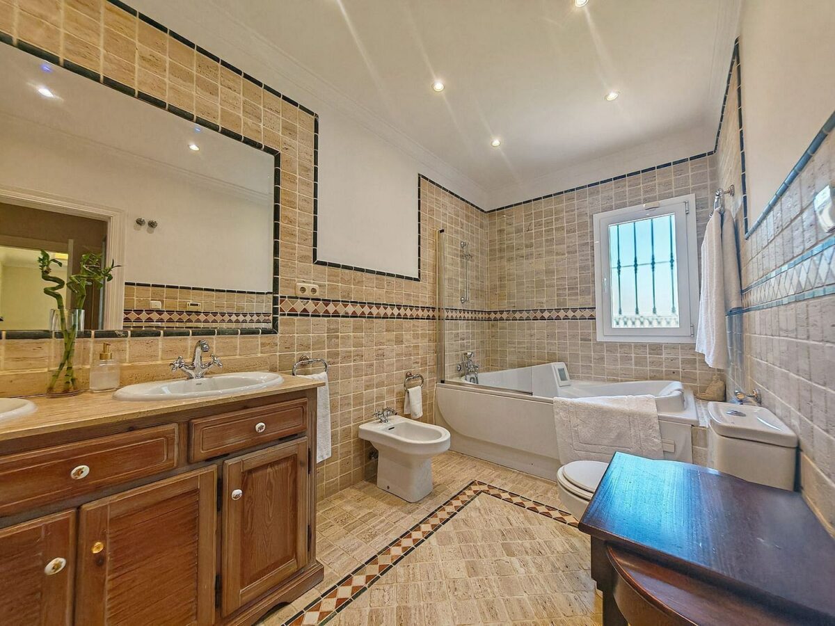 Spacious south-west facing villa with pool steps from the beach in Elviria, Marbella