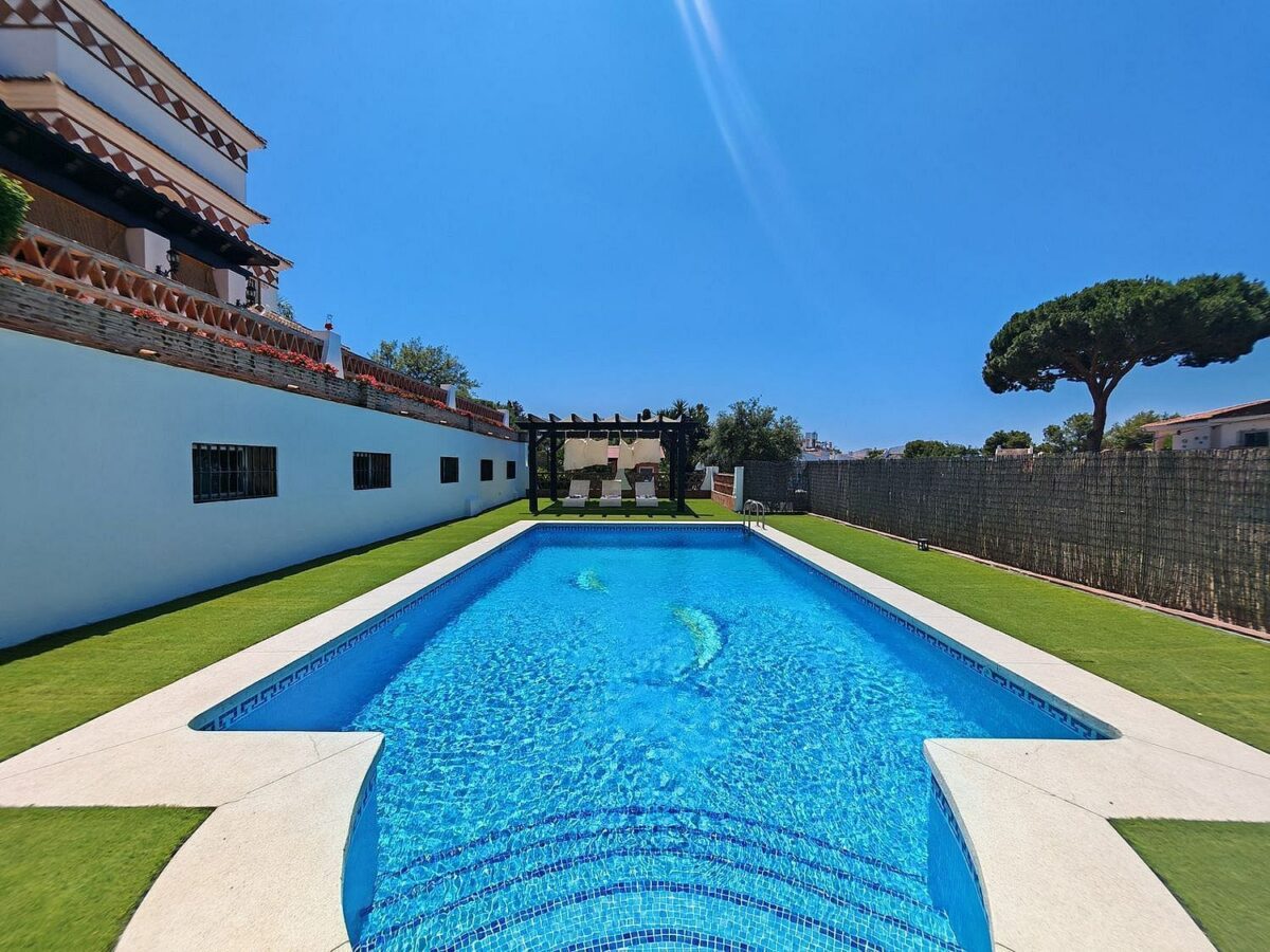 Spacious south-west facing villa with pool steps from the beach in Elviria, Marbella