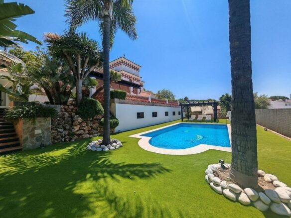 Spacious south-west facing villa with pool steps from the beach in Elviria, Marbella