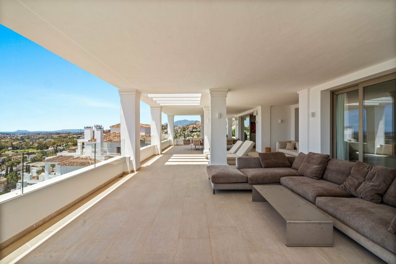 Covered terrace with lounge seating and sea views