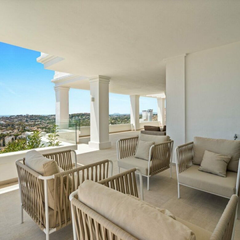 Covered terrace with seating and panoramic views
