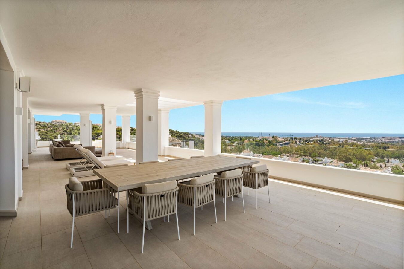 Covered terrace dining area with sea views