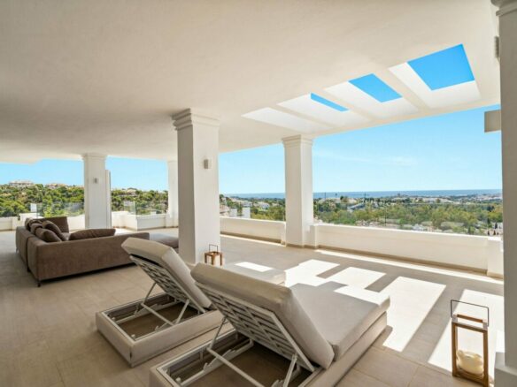 Terrace with sun loungers and skylights