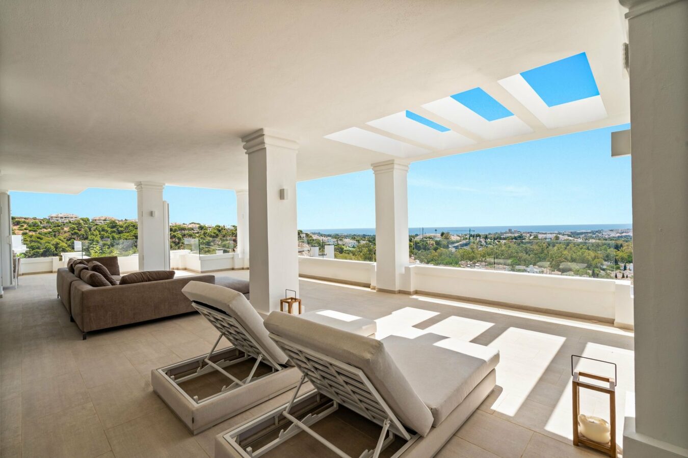 Terrace with sun loungers and skylights