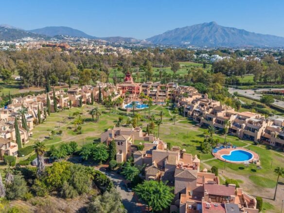 Aerial overview of the Atalaya residential complex, communal gardens and swimming pools