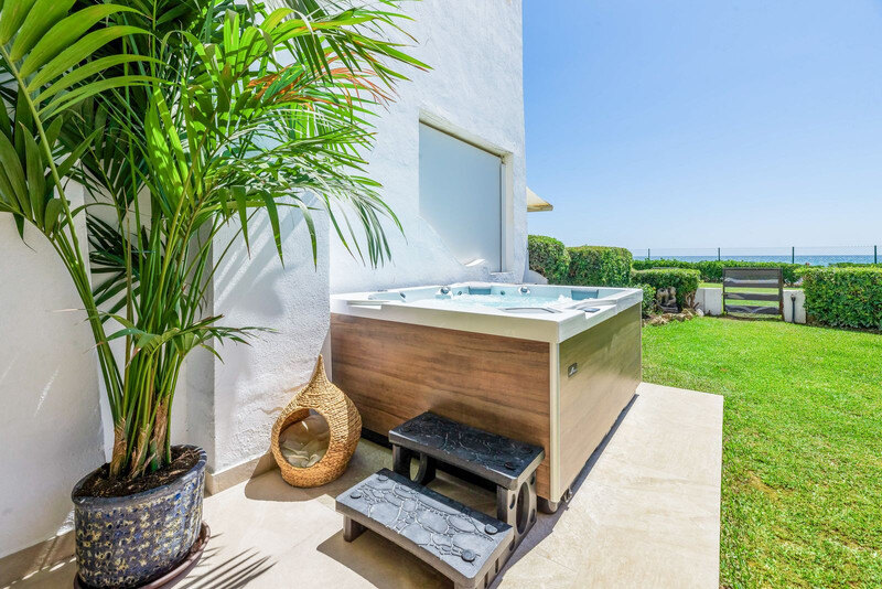 FOR SALE 🏡 Renovated Frontline Beach Townhouse with Private Garden and Jacuzzi – Las Chapas, Marbella East 🇪🇸
